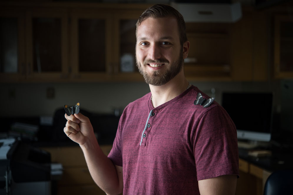 PhD candidate Evan Kristiansen (GRS’20). Kristiansen and his advisor, associate professor of biology Sean Mullen, study butterflies to understand the genetics of speciation. Photo by Cydney Scott