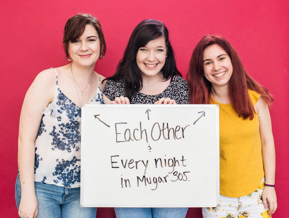 BU students in the Class of 2018 hold a sign saying they will miss each other