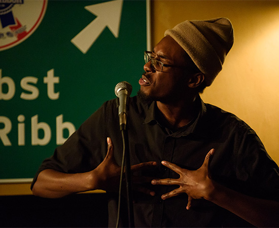 Evan Jymaal Cutts performs at a poetry slam.