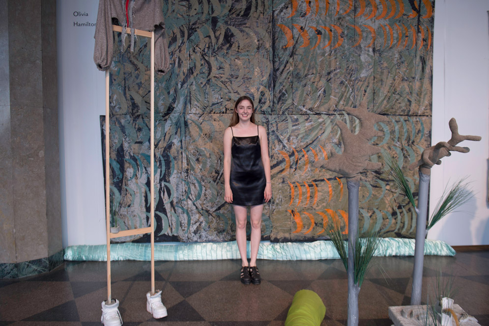 Olivia Hamilton with her art project made of recycled objects 