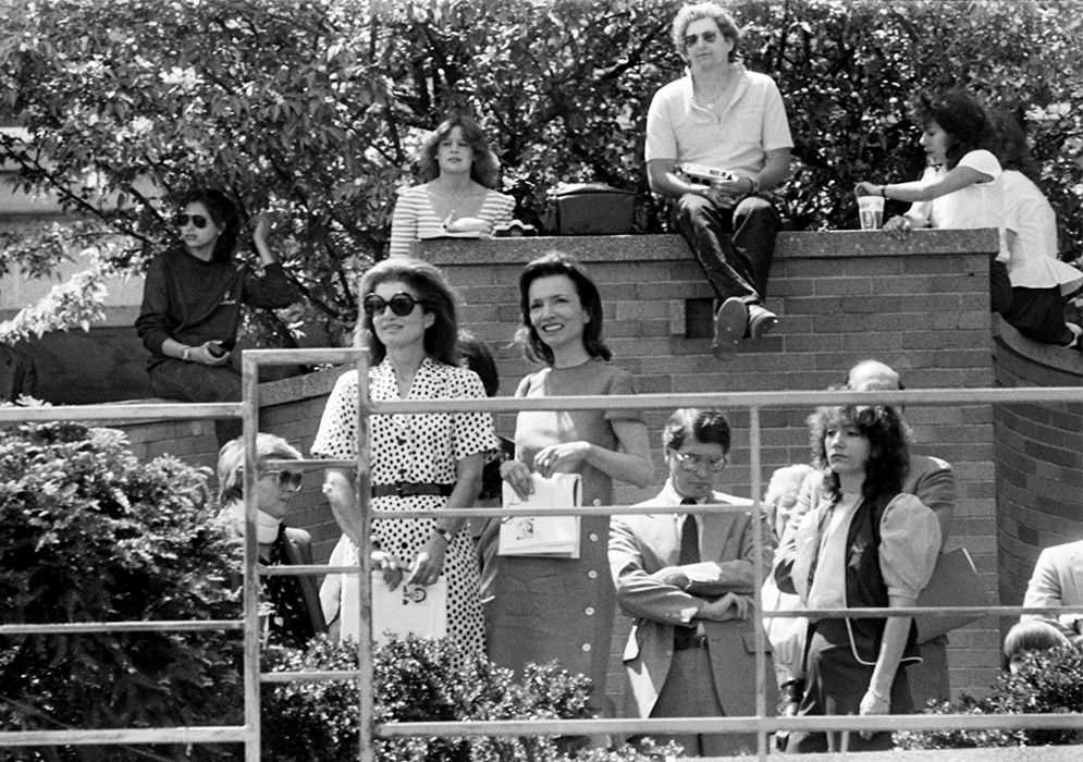 Jacqueline Kennedy Onassis (in large shades) attended the BU Commencement ceremony at Nickerson Field with her younger sister Lee Radziwill, who was there to see her son Anthony graduate from the BU College of Communication.