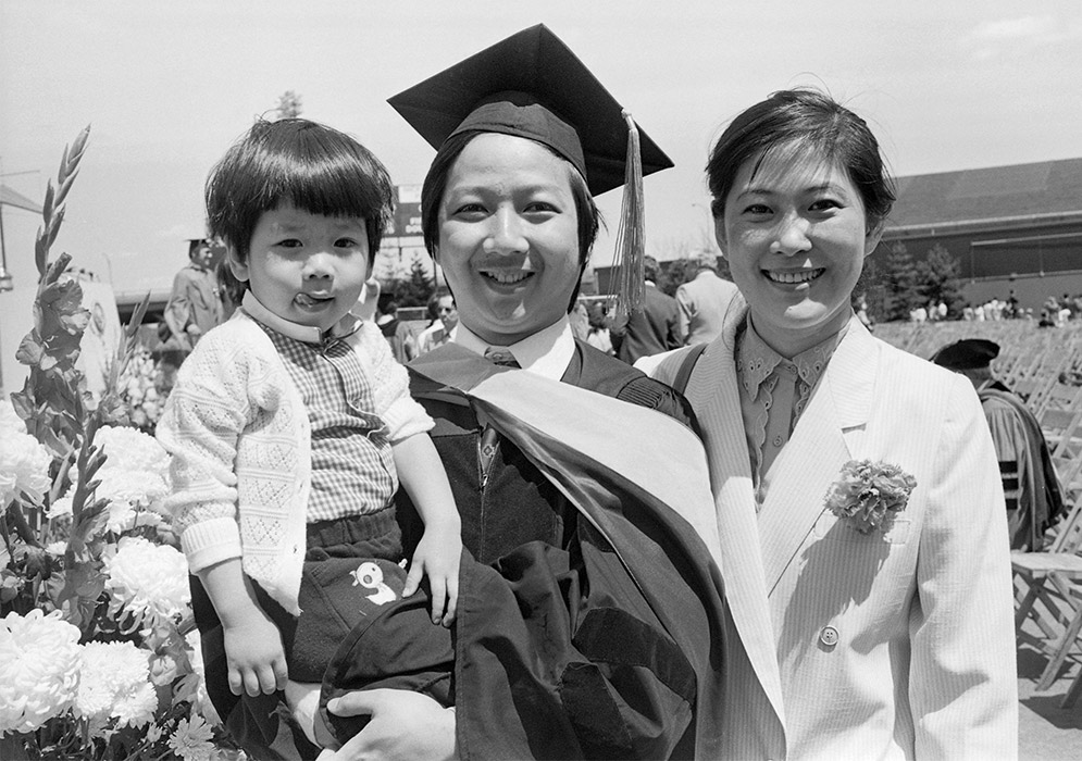 A graduate celebrates with family after the BU Commencement on May 13, 1984.