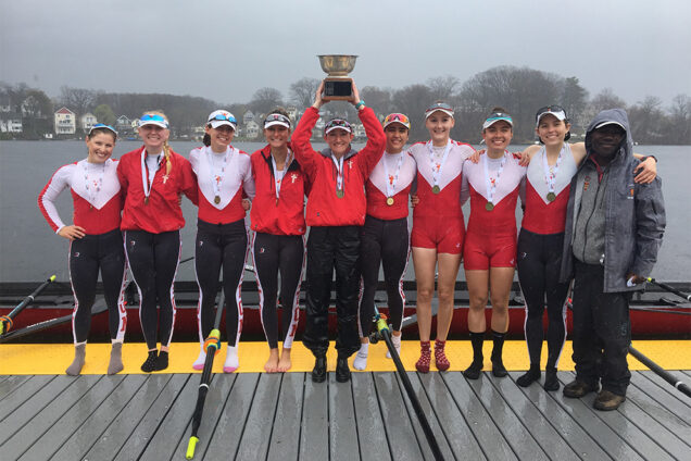 The Boston University Terriers women’s lightweight rowing team hold their gold medal trophy from the 2018 Eastern Sprints.