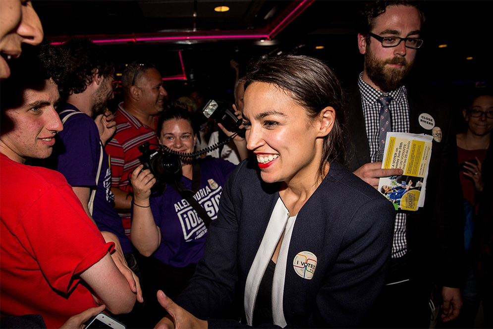 Progressive Democrat Alexandria Ocasio-Cortez celebrartes with supporters at a victory party in the Bronx after upsetting incumbent Democratic Representative Joseph Crowly on June 26, 2018 in New York City. Ocasio-Cortez upset Rep. Joseph Crowley in New York’s 14th Congressional District.