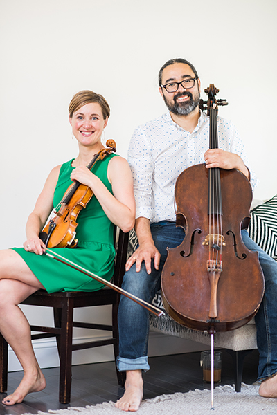 Professional classical musicians Sasha Callahan and Leo Eguchi pose for a portrait