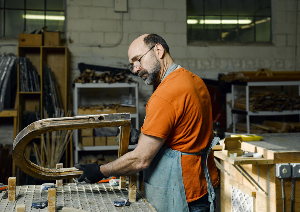 Steve Hall working on a section of a window pane