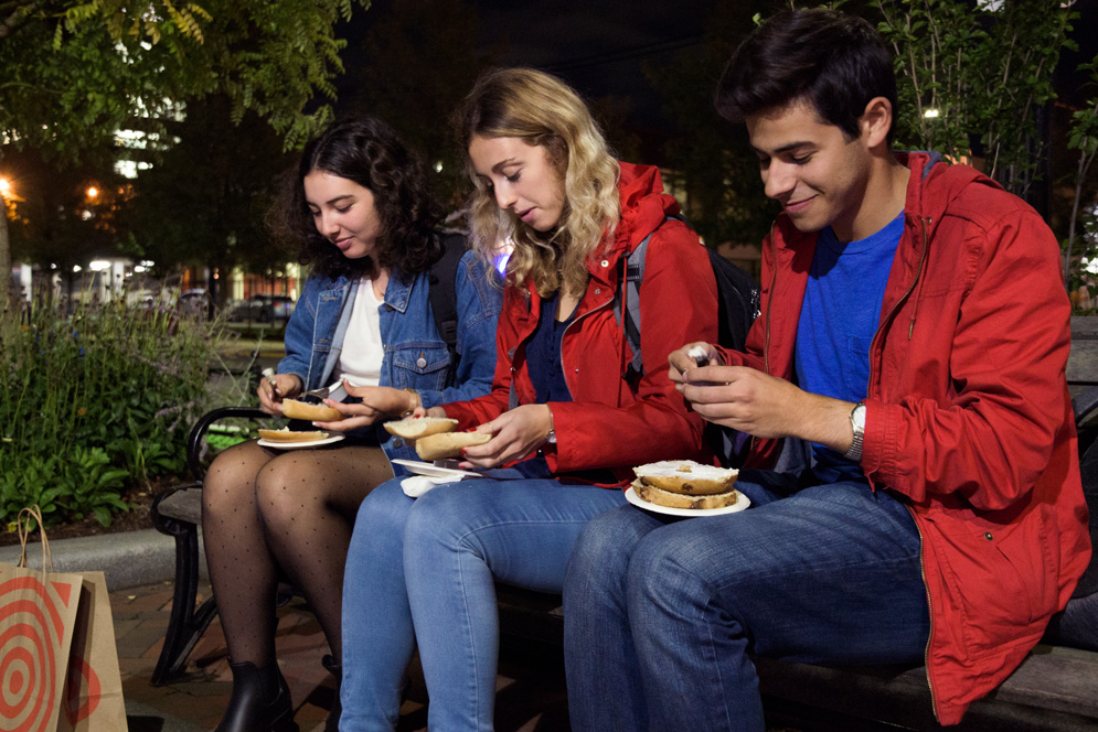 students eat bagels to celebrate breaking fast after Yom Kippur