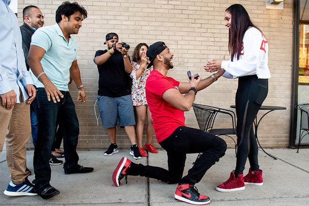 Tenn Buick surprises Swasti Shukla on their 10th anniversary with a flash mob proposal in front of Warren Towers, the place they first met, on Sept. 15, 2018.