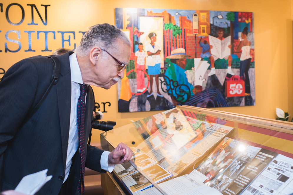 Melvin B. Miller examines the exhibit