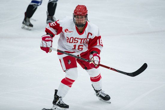 One of the captains, Sammy Davis, skates on the ice