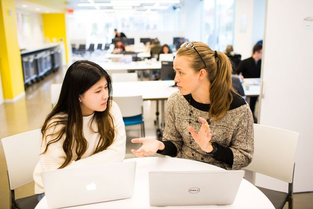 Qianhui (Jessica) Rong (CGS’22), left, works with her Hub cocurricular supervisor, Rouwenna Altemose. Photo courtesy BU Hub (two students sitting in a student lounge)