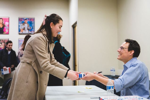 Sydne Garcia (COM'2020) gets her booked signed by MSNBC correspondent and Boston University alumn Steve Kornacki