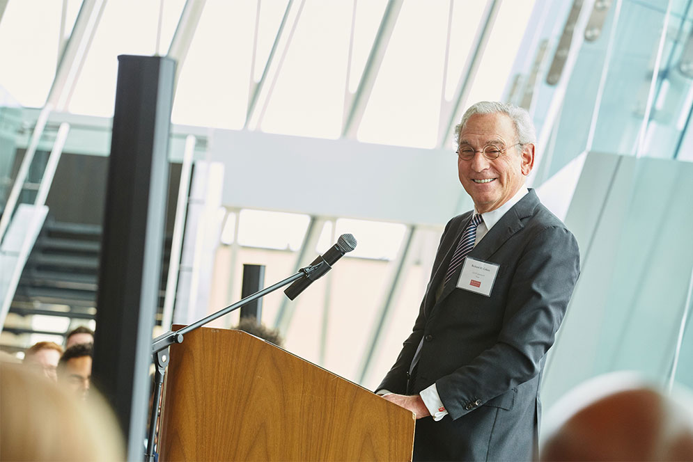 Boston University trustee Richard D. Cohen smiles as he speaks to a crowd at the Cohen Scholar Reception.