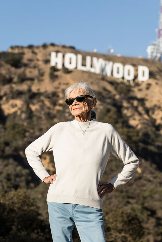 Jo Farkas poses for a photograph in front of the iconic Hollywood sign