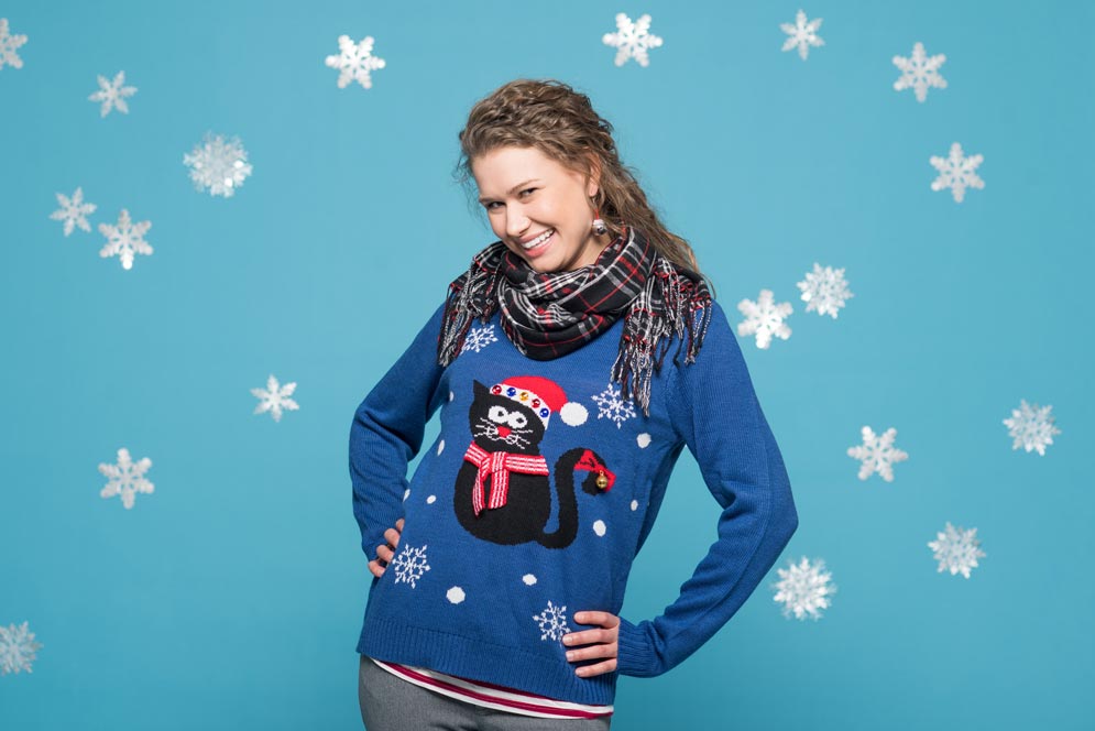 Maureen Desmond sports a ugly sweater with a cat on it