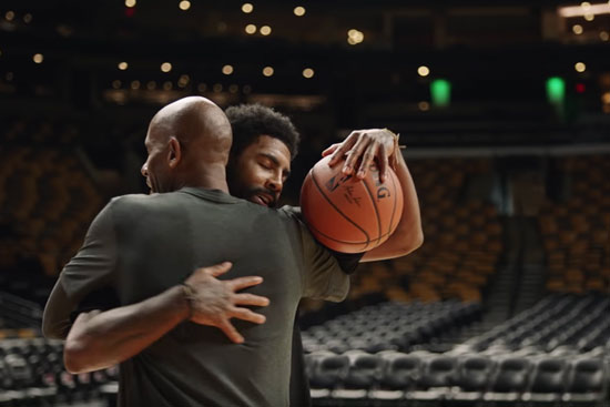 Kyrie Irving hugs his dad, Drederick Irving