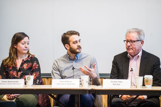 Students speak on a panel about their internships. 