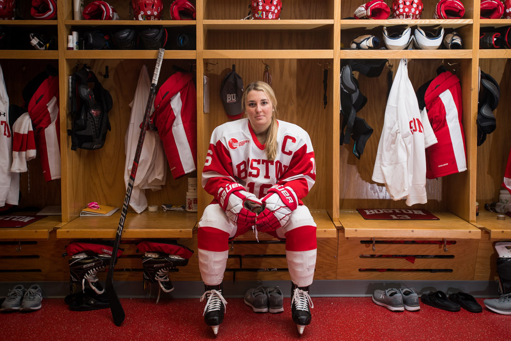 Sammy Davis wears her hockey uniform in the locker room