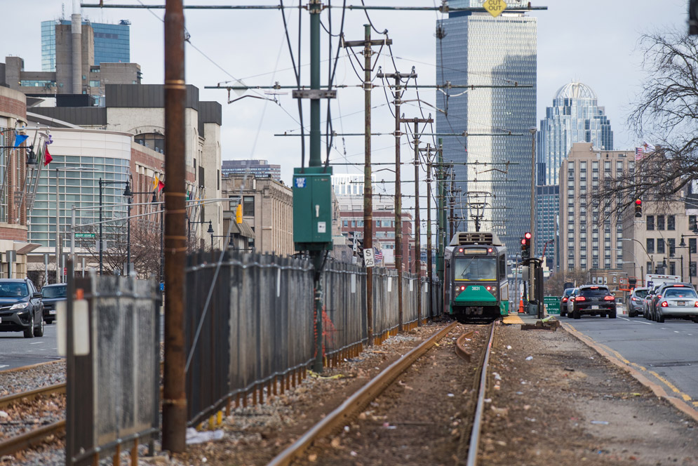 A B line train breaks at a stop along Commonwealth Avenue