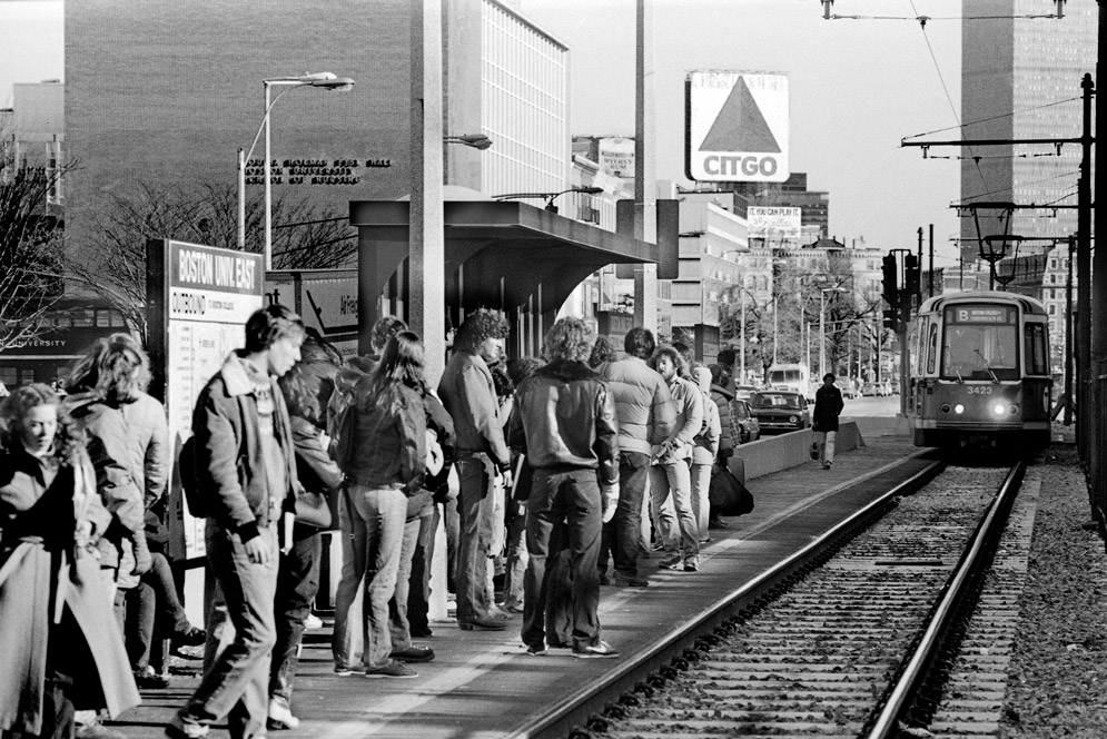 Students wait for the B line train