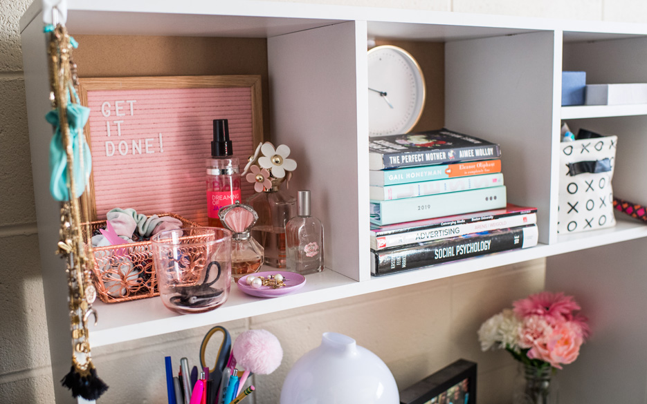 A cubby used to store books, skincare products, and jewelry