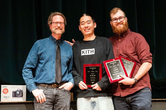 Goeff Poister presents the best film award to Zhinan Zhao (COM'18) and Eric Moots (COM) during the Redlist Film Festival award ceremony on Friday night at the Tsai Performance Center. Photo by Jacob Chang-Rascle (COM'22)