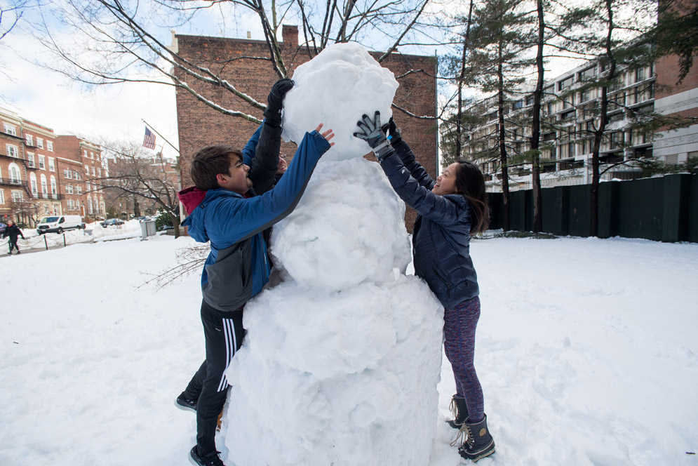 Students build a snowman