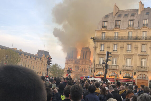 Photo of the Notre Dame Cathedral in Paris France showing the roof and spire on fire, April 15, 2019.