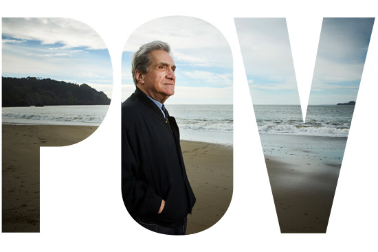 Robert Pinsky standing on a beach, inside the letters P O V