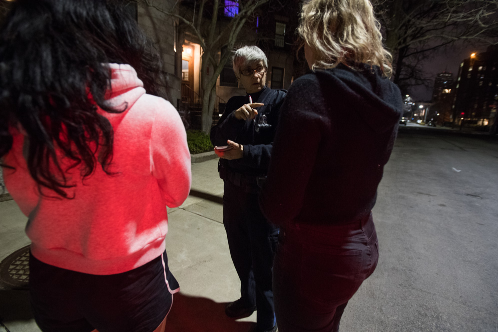 BUPD Officer Nancy O'Loughlin talks with BU students after they called BUPD about a missing friend