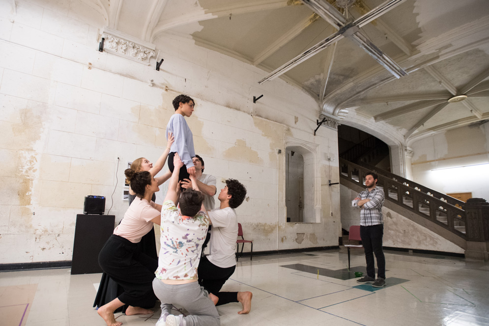 Jeremy Ohringer (CFA’19), in plaid shirt, runs a rehearsal for Horizon Line in the CFA.