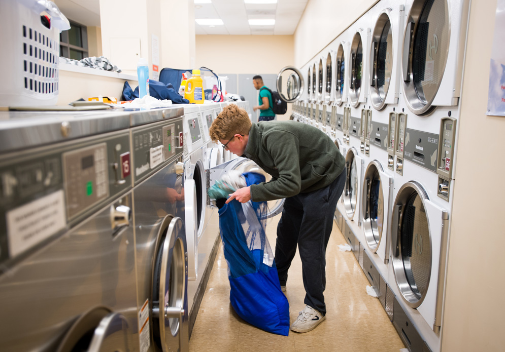 A student does laundry late at night