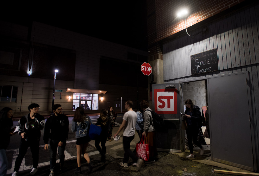 Two students, who are dating, play chess together at Bay State Underground