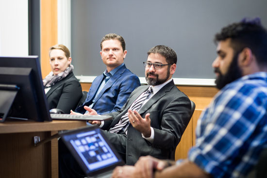 Imran Malek, a second year BU School of Law student, moderates an “Ask Us Anything” panel with the law firm Latham & Watkins