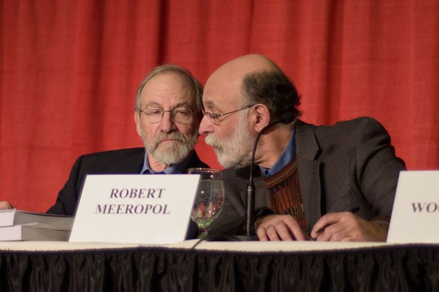 Michael and Robert Meeropol at a table during a panel discussion