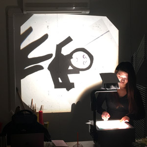 an overhead projection of a stick figure like puppet