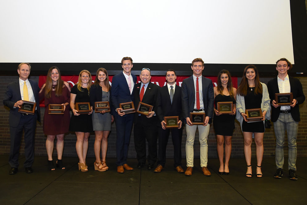 Brian Durocher (Wheelock’78) (from left), Alex Heinen (CGS, COM), Ally Hammel (CGS, Sargent), Pietra Sweeney (Sargent), Grant Eberst (Sargent), Daryl DeLuca, Chris Gray (CGS), Trevor Winans (CAS), Remi Ramos (Questrom), Reagan Rust (CAS) and Johnny Kemps (Questrom) holding their awards