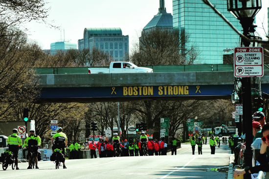 police officers patrolling at kenmore square near the finish line of the boston marathon