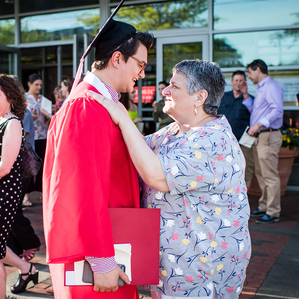 Marie DeSoto congratulates her son Sam DeSoto after graduation.