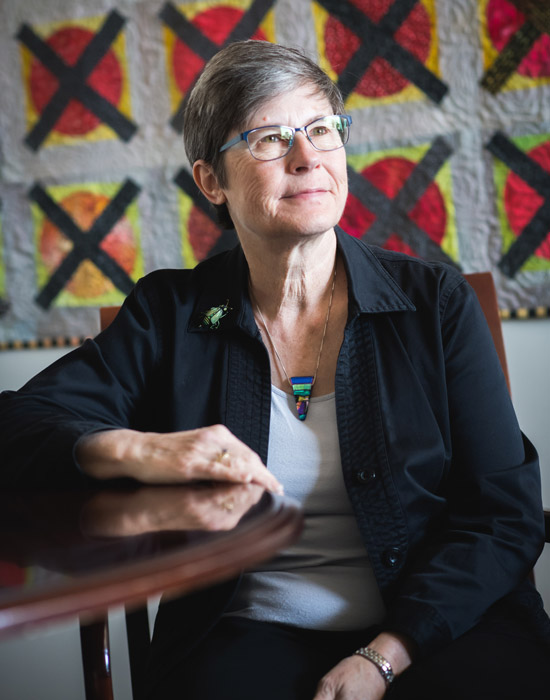 portrait of Julie Sandell looking off into the distance