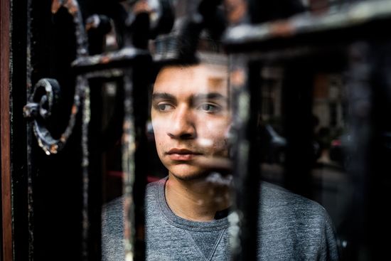 David Gonzalez stares out of a window at BU