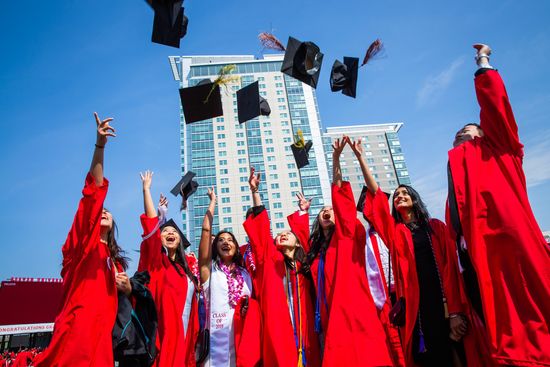 Students throw their caps in the air