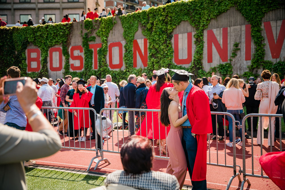 A BU grad shares a celebratory embrace just after the 2019 Boston University 