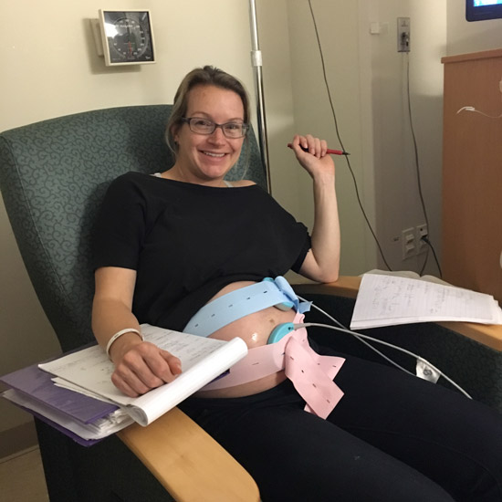 Liz Upton getting work done both on her baby and on her PhD at Newton-Wellesley Hospital