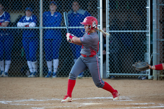 Emily Morrow swinging a metal bat