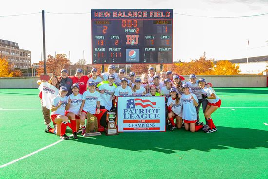 The BU softball team poses with their Patriots League trophy