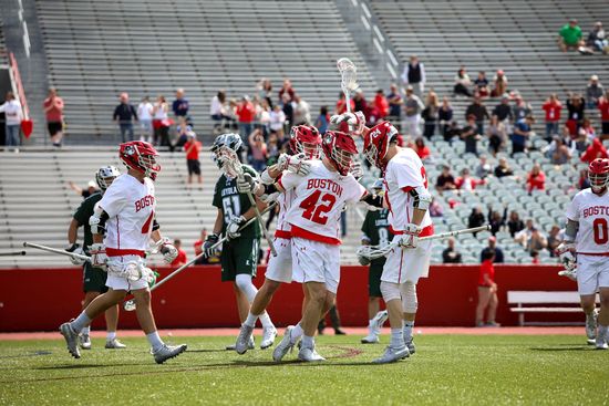 The BU Lacrosse team playing against Loyola's team