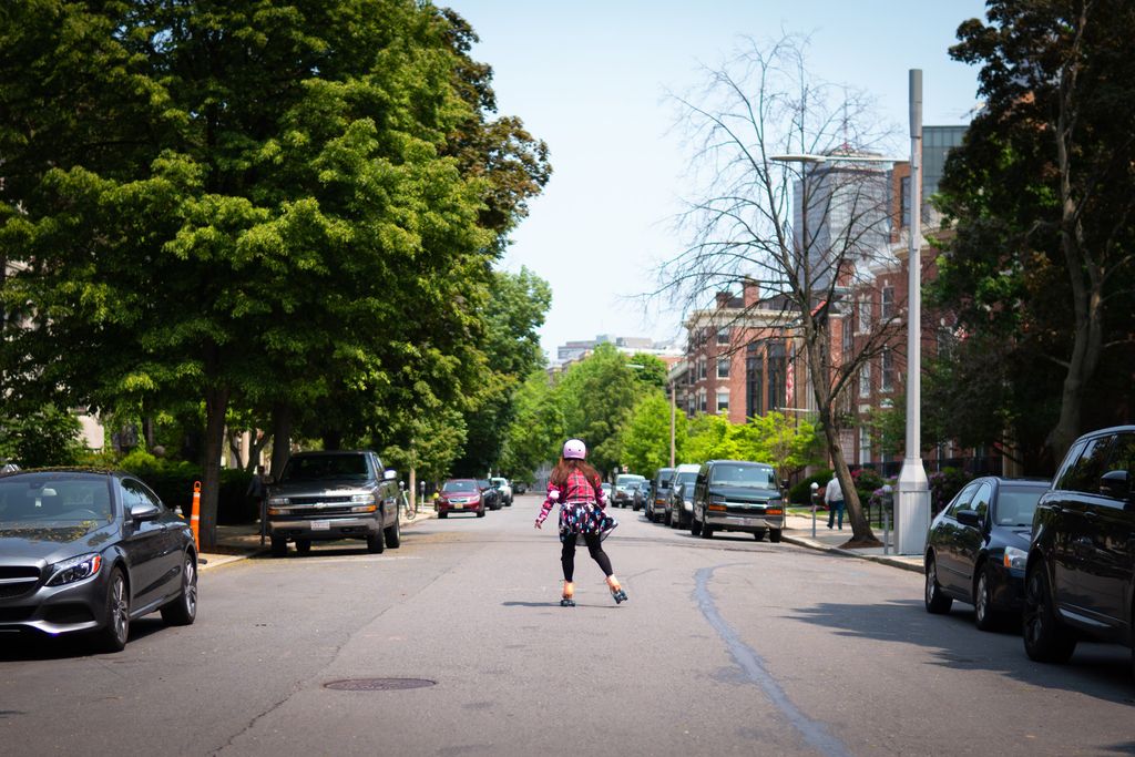 A Boston University student roller-skates down Bay State Road.
