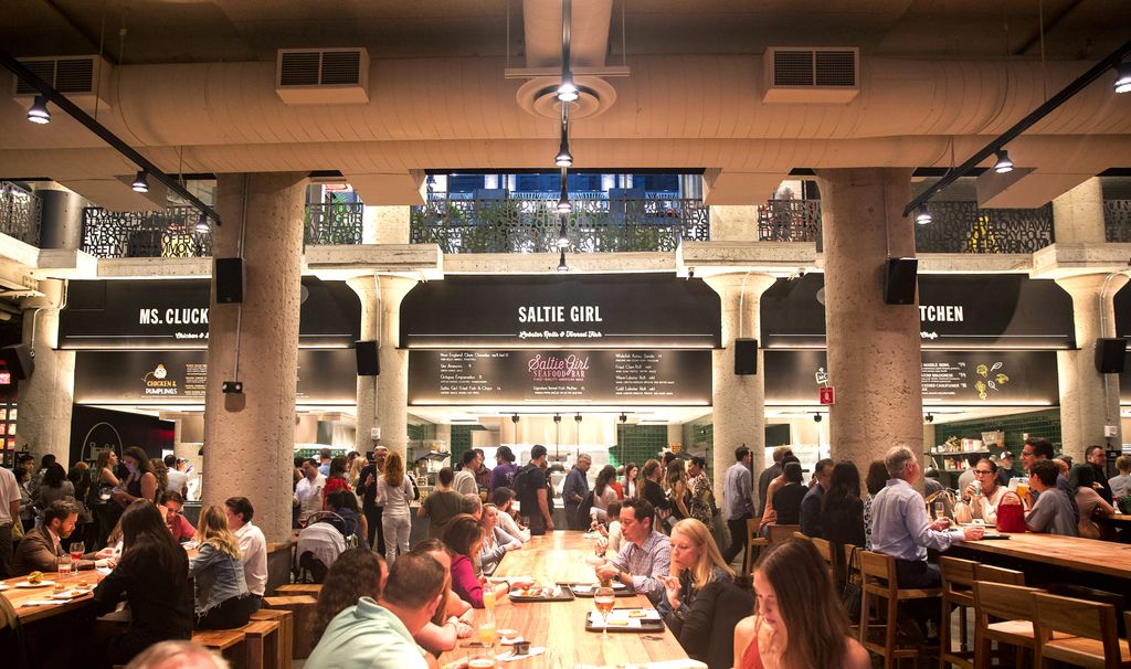 People gather at the opening of Time Out Market Boston