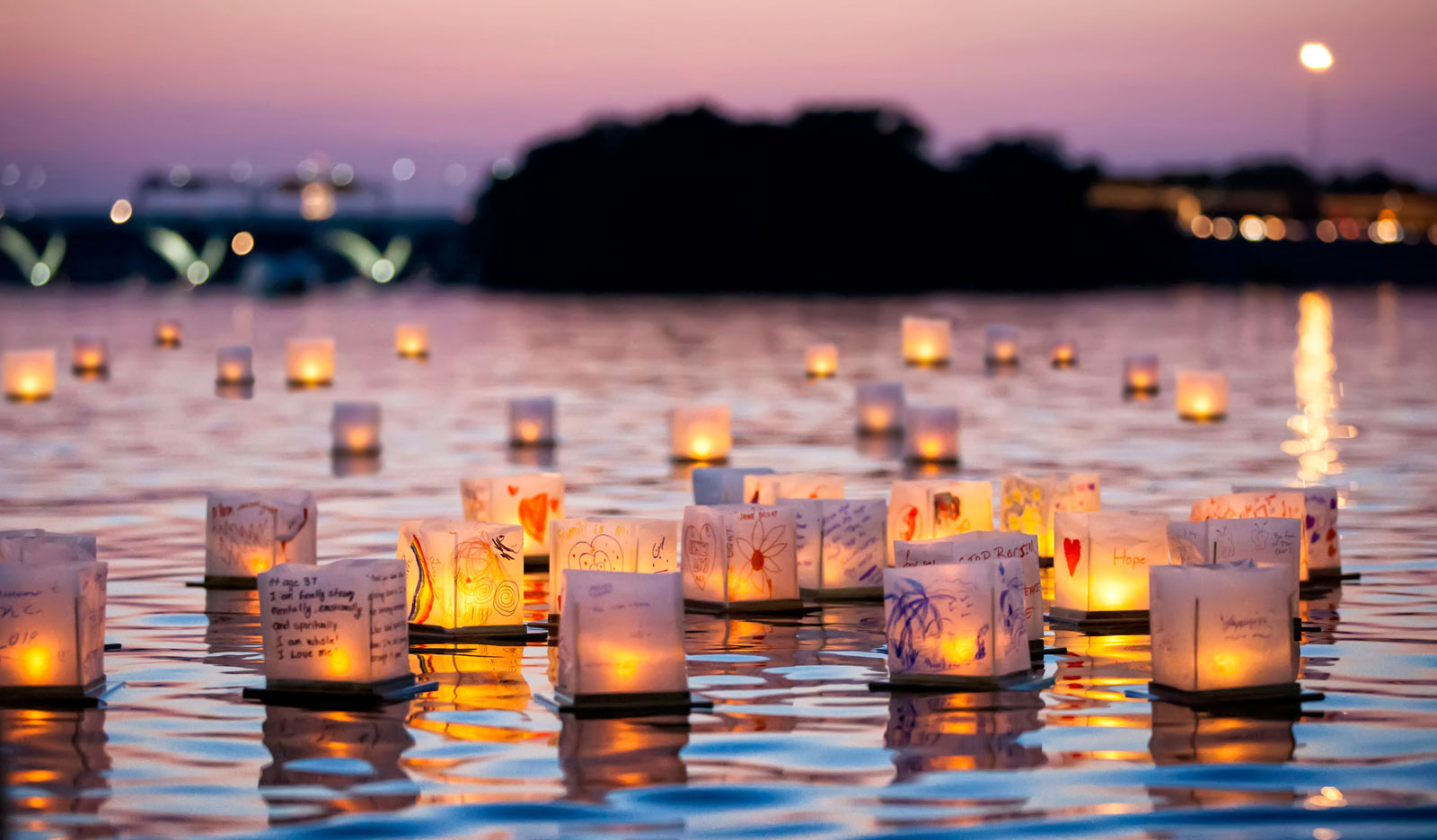 On Saturday, July 27, the Charles River will be illuminated by hundreds of water lanterns during the Boston Water Lantern Festival. Photo courtesy of Water Lantern Festival